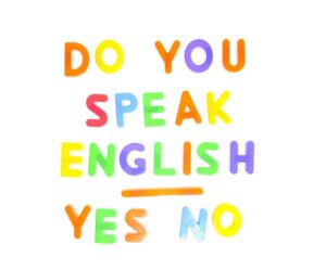 「英語を話せますか」と英語で書かれたパネル